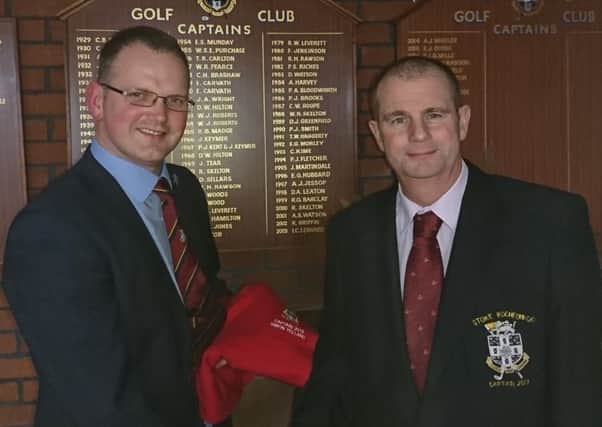 New skipper Simon Yelland (left) receives the captains sweater from Martin Harvey EMN-180216-085559002
