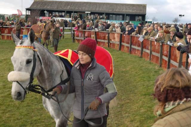Punters take a final look at who to back in the Garthorpe parade ring EMN-180221-154032002