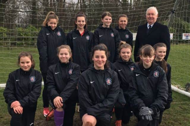 Mowbray Rangers Girls in their new rain jackets with sponsor John Southerington