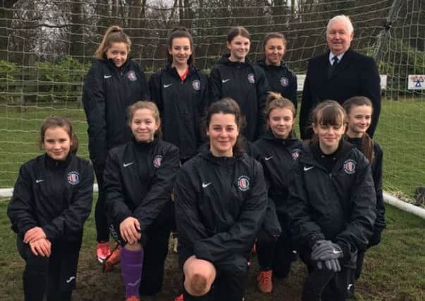 Mowbray Rangers Girls in their new rain jackets with sponsor John Southerington