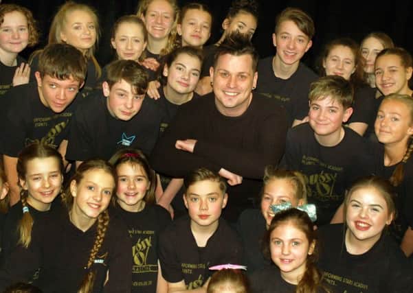 All Together Now TV star Dylan Hutchinson with some members of Melton's Performing Stars Academy EMN-180226-155526001