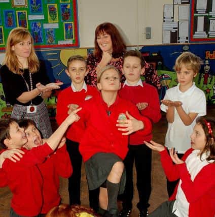 Lisa Gackowska, lead professional for English, and head Julia Hancock act out a scene from a Shakespeare play with pupils as part of Asfordby Captain's Close Primary School's link-up with the Royal Shakespeare Company EMN-180223-115535001