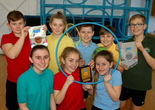 House captains at St Michael & All Angels C of E Primary School at Rearsby show off the school's coveted gold sports award EMN-180223-115843001