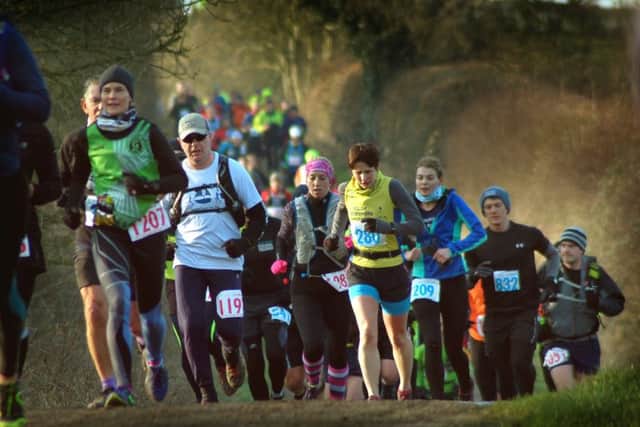 Runners climb out of the Vale of Belvoir to make their way through land on the Belvoir Estate EMN-180226-155504001