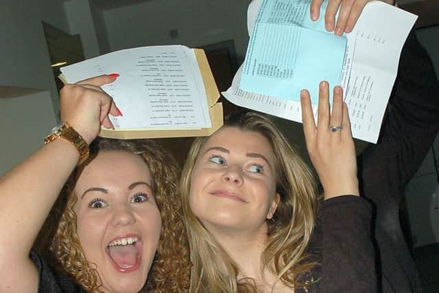 Leah Reek (left) and her friend Phoebe Loomes celebrate after GCSE results were revealed at Long Field Academy in Melton in 2015 EMN-180226-160813001