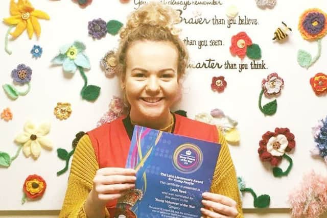 Leah Reek with her certificate for being nominated for an award through her voluntary work with LOROS EMN-180227-124802001