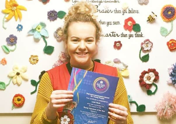 Leah Reek with her certificate for being nominated for an award through her voluntary work with LOROS EMN-180227-124802001