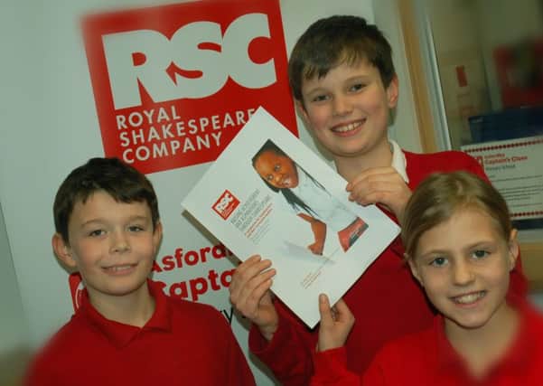 Asfordby Captain's Close Primary School pupils William, Ryan and Grace celebrate their link-up with the Royal Shakespeare Company EMN-180223-115520001