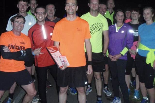 Rob Beers pictured with the Run England Group Leader of the Year award in 2015 EMN-180603-100105002
