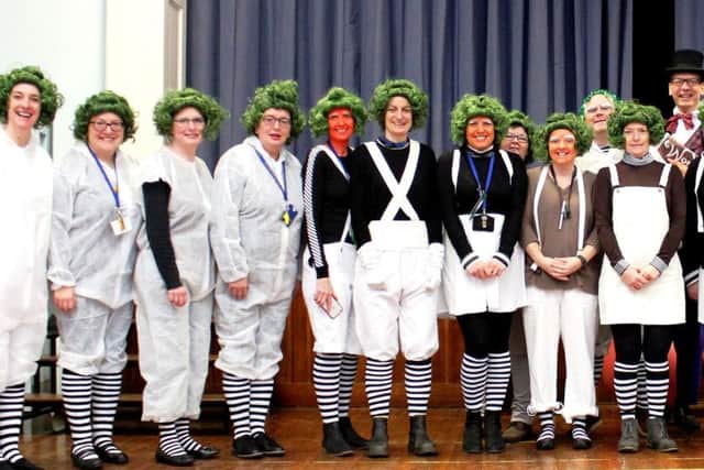 Staff at St Francis Catholic Primary School dressed as Oompa Loompas from Roald Dahl's Charlie and the Chocolate Factory. Mr Hallam took on the role of Willy Wonka PHOTO: Supplied