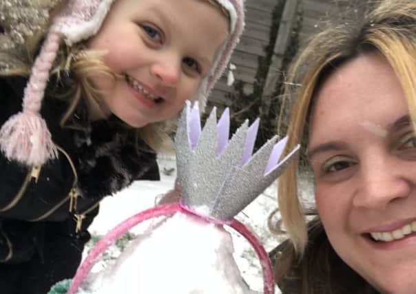 Mrs Copeland (teacher at Redmile) with daughter Ruby and their snow penguin from 'Tacky and the Emperor' by Helen Lester PHOTO: Supplied