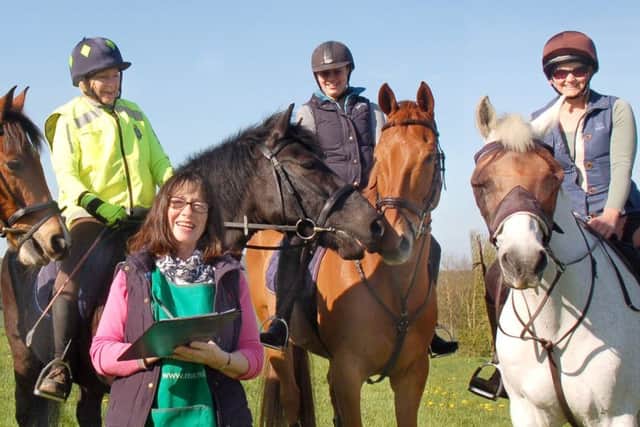 Christine Griffin from Macmillan sees a group of riders on their way PHOTO: Tim Williams
