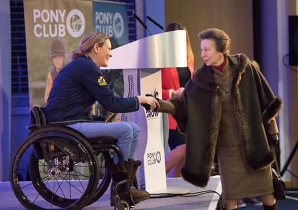 Paralysed fundraiser Claire Lomas meets Princess Anne when she was guest speaker at the Pony Club Conference

Photo: Kieron Tovell EMN-180313-085420001
