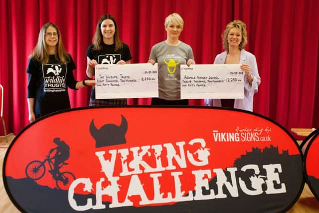 Jane Noad, incoming chairperson for the Viking Challenge Committee (blonde hair), presents Redmile head teacher Julie Hopkins (right), and Cally Keetley (dark hair) and Holly McCain (left) trustees from Nottinghamshire Wildlife Trust with their cheques PHOTO: Caroline Addison