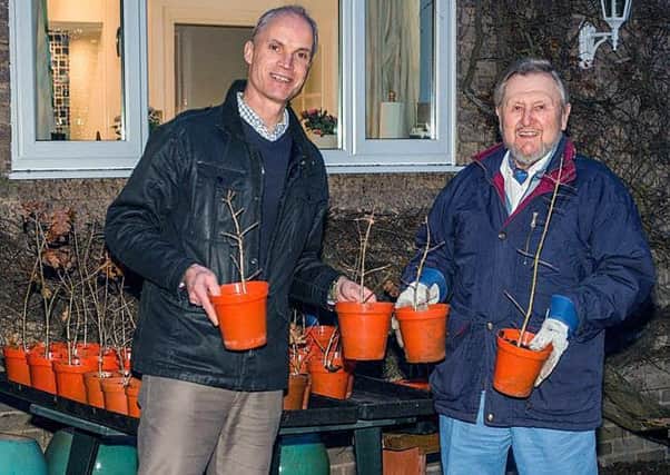 Rotarian Mike Hind-Woodward donating 65 English oak trees to Simon Bentley, the director of Leicestershire and Rutland Wildlife Trust PHOTO: Supplied