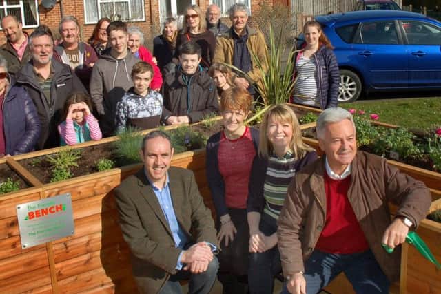 Sir Alan Duncan tries out the Friendly Bench at Bottesford with committee members Jason and Lyndsey Young, and Caroline Arthur EMN-180328-125203001