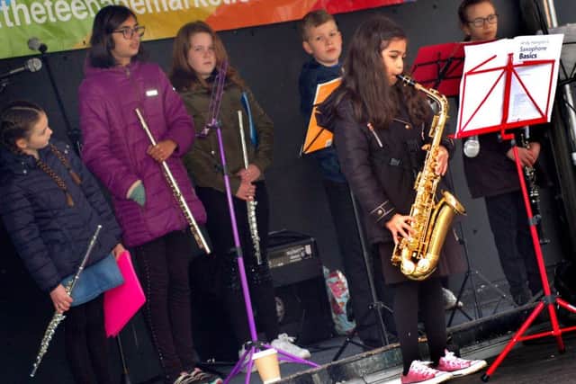 A small saxophonist with Heather's MusicGarten PHOTO: Tim Williams