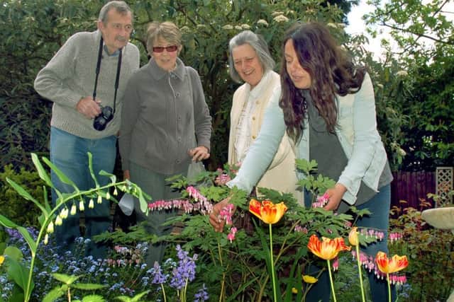 Owner of Tresillian House Alison Blythe shows Alan and Carole Hewitt around the flower beds with horticultural expert Christina Moulton PHOTO: Tim Williams