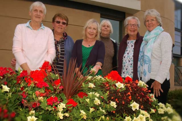 Marie Walters (third from left) with fellow volunteers in the Melton In Bloom team which helped achieve a prestigious Silver Gilt award for the town in this year's judging EMN-180504-130705001