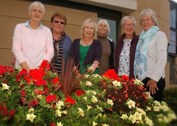 Marie Walters (third from left) with fellow volunteers in the Melton In Bloom team which helped achieve a prestigious Silver Gilt award for the town in this year's judging EMN-180504-130705001