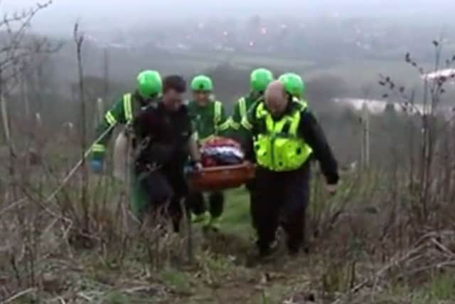 Darryl Cunnington is carried away on a stretcher after being assaulted by two members of the Belvoir Hunt near Stathern EMN-181004-144855001