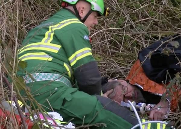 Professional investigator Darryl Cunnington being treated by a medic after being assaulted by two members of the Belvoir Hunt EMN-181004-145240001