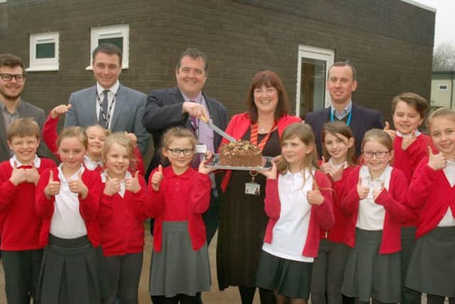 Julia Hancock, head teacher at Asfordby Captain's Close Primary School, celebrates the opening of a new classroom with pupils, architects and the CEO of Discovery Schools Trust EMN-181104-142117001