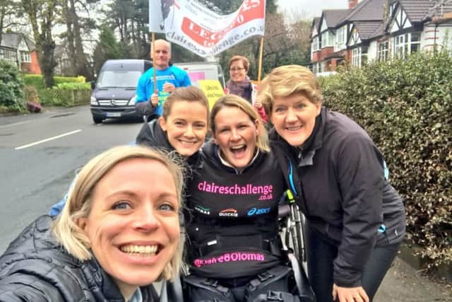 Claire Lomas gets support during her marathon walk from TV presenter Clare Balding and Great Britain Olympic champion hockey players Helen and Kate Richardson-Walsh EMN-180416-160150001