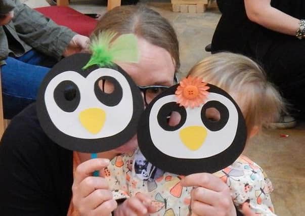 You can't see them! Mum and daughter have fun with their penguin masks PHOTO: Supplied