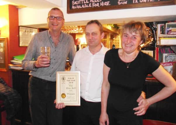 Melton CAMRA chairman Kevin Billson with landlords Mike Lynn and Clare Highton at the Blue Bell, Hoby, which has been named CAMRA Melton Area Pub Of The Year 2018 EMN-180423-153254001