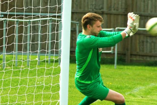 Connor Middleton makes the crucial penalty save EMN-180424-092940002