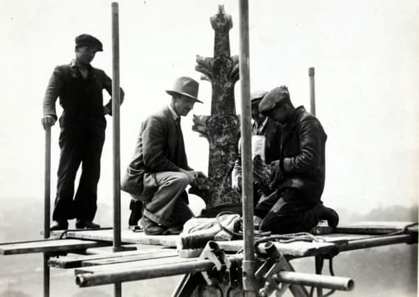 1933 photo of men performing maintenance work on the roof of St Mary's Church in Melton EMN-180424-170910001