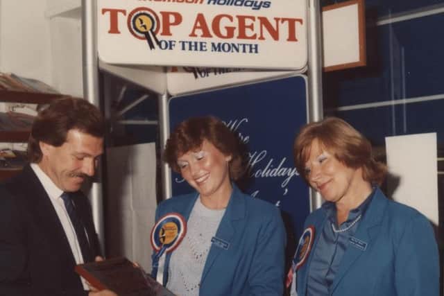 Gunvor Carrington (right) receives an award with colleague Caroline Bacon for her travel branch being the top agent of the month for Thomson Holidays EMN-180425-165127001