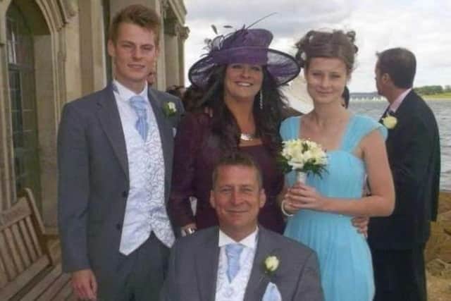 Stewart Sparling with his wife, Angie, and children Lewis and Caitlyn at a family wedding in 2013 EMN-180427-130605001