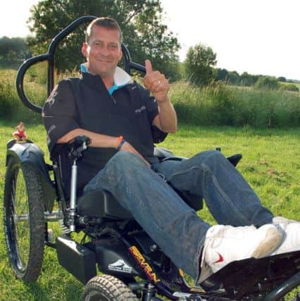 Stewart Sparling testing out the life-changing specialised wheelchair he got in 2013 PHOTO: Tim Williams EMN-180427-130554001