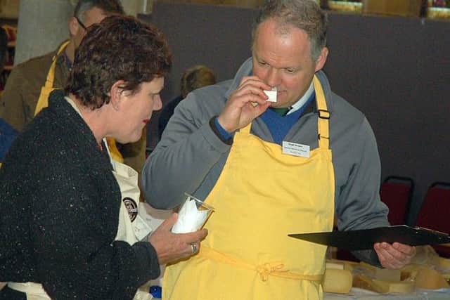 Hugh Brown, CEO at Melton Livestock Market, judges one of the hundreds of cheeses entered for this year's awards EMN-180427-143546001