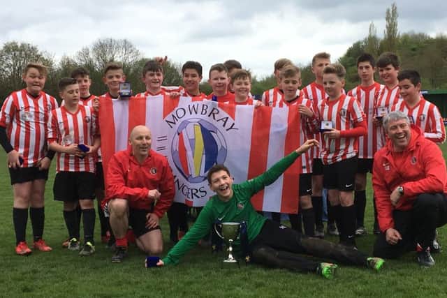 The Tigers are all smiles after getting their hands on the Chairman's Cup EMN-180105-144454002