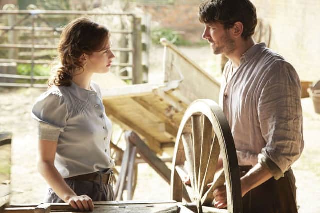 Lily James as Juliet Ashton and Michiel Huisman as Dawsey Adams PHOTO: PA Photo/StudioCanal/Kerry Brown