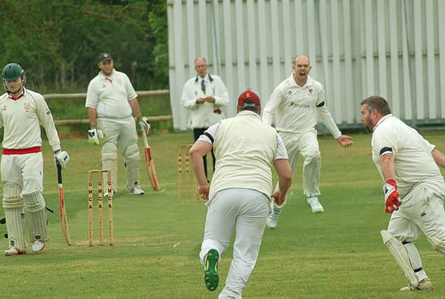 Tom Glover celebrates the wicket of Myles Hickman, brilliantly caught by wicketkeeper Matt King. EMN-180515-091856002
