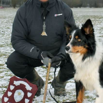 John O'Gaunt champion sheepdog trainer Nij Vyas with his sheepdog Cody and the UK Four Nations Nursery Championship they recently won.
PHOTO BY ELAINE HILL EMN-181105-133440001