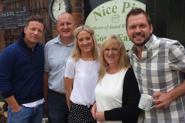 Jamie Oliver (left) and Friday Night Feast co-presenter Jimmy Doherty (right) with the Walmsley family, from left, Phil, Aimi and Kath at the Old Dalby base of Nice Pie EMN-181105-143034001