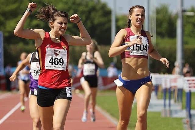 Mari raises her arms in triumph as she pips top Scottish prospect Mhairi Hendry in the 800m final EMN-180515-115937002