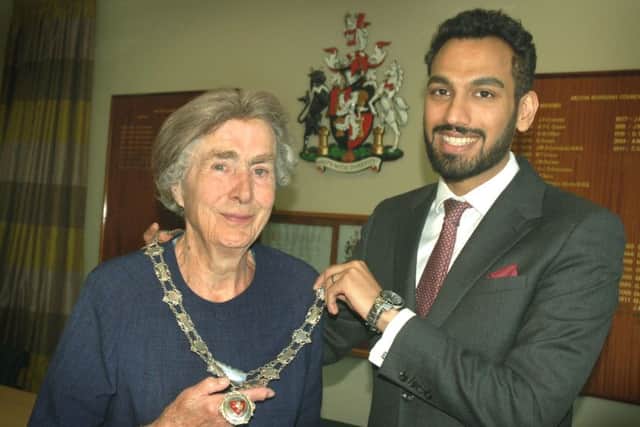 New Mayor of Melton, Councillor Pru Chandler, receives the chains of office from outgoing Mayor, Councillor Tejpal Bains EMN-180515-154118001