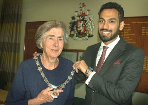 New Mayor of Melton, Councillor Pru Chandler, receives the chains of office from outgoing Mayor, Councillor Tejpal Bains EMN-180515-154118001