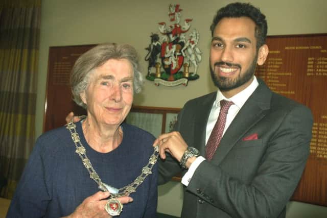 New Mayor of Melton, Councillor Pru Chandler, receives the chains of office from outgoing Mayor, Councillor Tejpal Bains EMN-180515-154118001