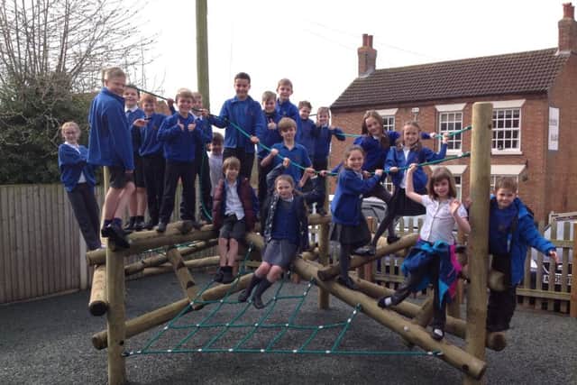 Children on the new climbing frame at Hose Primary School PHOTO: Supplied