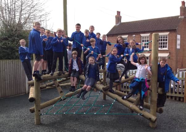 Children on the new climbing frame at Hose Primary School PHOTO: Supplied