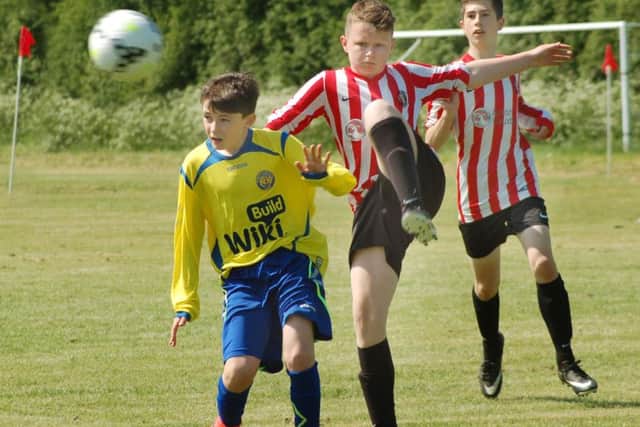 Mowbray Rangers Tigers (red and white stripes) take on Irish side Monaghan United in thr U13s competition EMN-180522-120935002