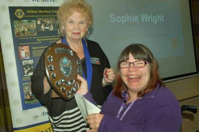 Lions Lesley Godber presents Sophie Wright with her Endeavour and Achievement Award PHOTO: Tim Williams