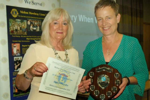 Slippery When Wet were most original team name award winners presented by Lion Wanda Buffey PHOTO: Tim Williams